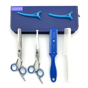 This baby hair scissor set with rounded tips includes thinning shears, combs, hairpins, and a leather case for safe and precise home haircuts.