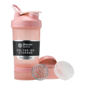 Rose pink BlenderBottle ProStak shaker bottle with pill organizer and powder storage for protein mixes.