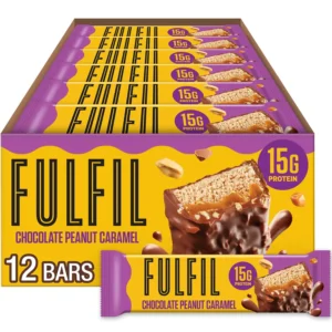 Twelve FULFIL Chocolate Peanut Caramel protein bars packed with 15g of protein and 8 vitamins for a fulfilling and delicious gluten-free snack.