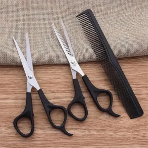 This three-piece stainless steel hair cutting set includes shears, thinning scissors, and a comb for professional or home use on men, women, and pets.