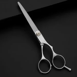 A professional stainless steel flat hair cutting scissor used by barbers and hairdressers.