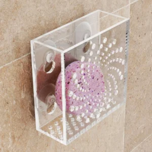 Clear acrylic shower steamer holder with suction cups and adhesive tape, designed to extend fragrance, prevent stepping, and avoid drain clogs on smooth shower surfaces.
