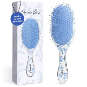 The AIMIKE detangling brush features ultra-soft FlexGlide nylon bristles designed to effortlessly remove knots and reduce hair breakage on thin or fine hair.