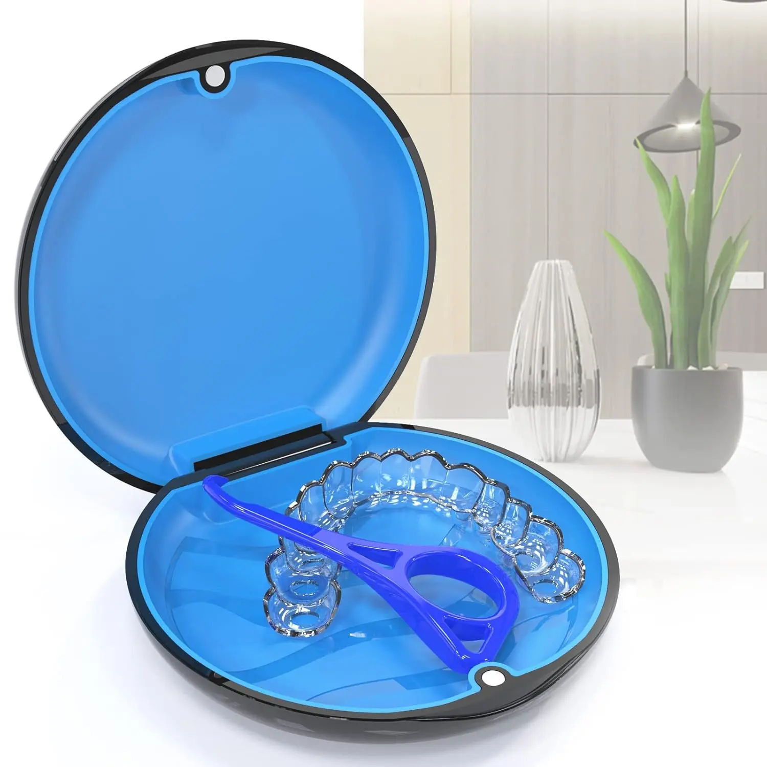 This black and blue aligner case with a magnetic closure and textured liner securely holds Invisalign aligners, night guards, or retainers and comes with two aligner removal tools.