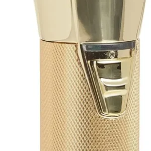 A close-up of the BaBylissPRO GOLDFX cordless hair clipper, a professional barber tool with a high-torque, Ferrari-designed engine for precise cuts on all hair types.