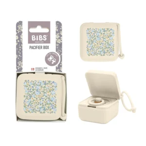 The Bibs x Liberty Eloise Ivory floral pacifier box keeps baby's pacifier clean and secure, made from safe, food-grade materials and includes a silicone string for attaching to a stroller.