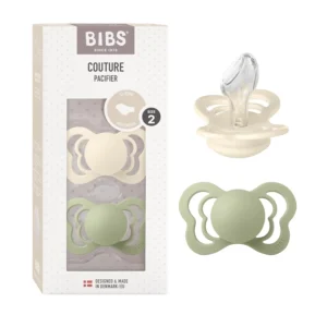 Two Bibs Couture Size 2 pacifiers in ivory and sage colors, made of food-grade silicone with an anatomically shaped nipple, designed for toddlers 6 months and older and manufactured in Denmark compliant with European Standard EN 1400+A2.