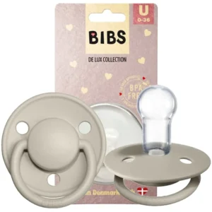 Sand-colored Bibs Delux size 1 pacifier made of organic Hevea rubber with a silicone suction tip, suitable for newborns and sterilizable at high temperatures.