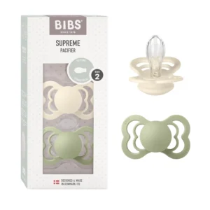 Two ivory and sage Bibs Supreme silicone pacifiers, size 2, designed for toddlers six months and older, featuring a symmetrical shape for jaw development and optimal airflow.