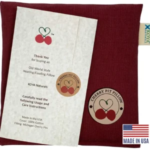 Henna red cherry pit filled heating pad for natural pain relief of sore muscles, joints, stomach aches, and menstrual cramps.