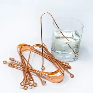 This is a 100% pure copper tongue cleaner designed for adults to gently remove bacteria and improve breath as part of an Ayurvedic oral hygiene routine.