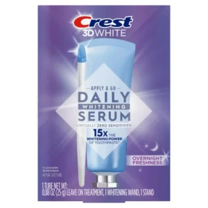 The Crest Whitening Emulsions kit includes a tube of whitening gel, a wand applicator, and a stand for easy storage, designed to whiten teeth and freshen breath while you sleep.