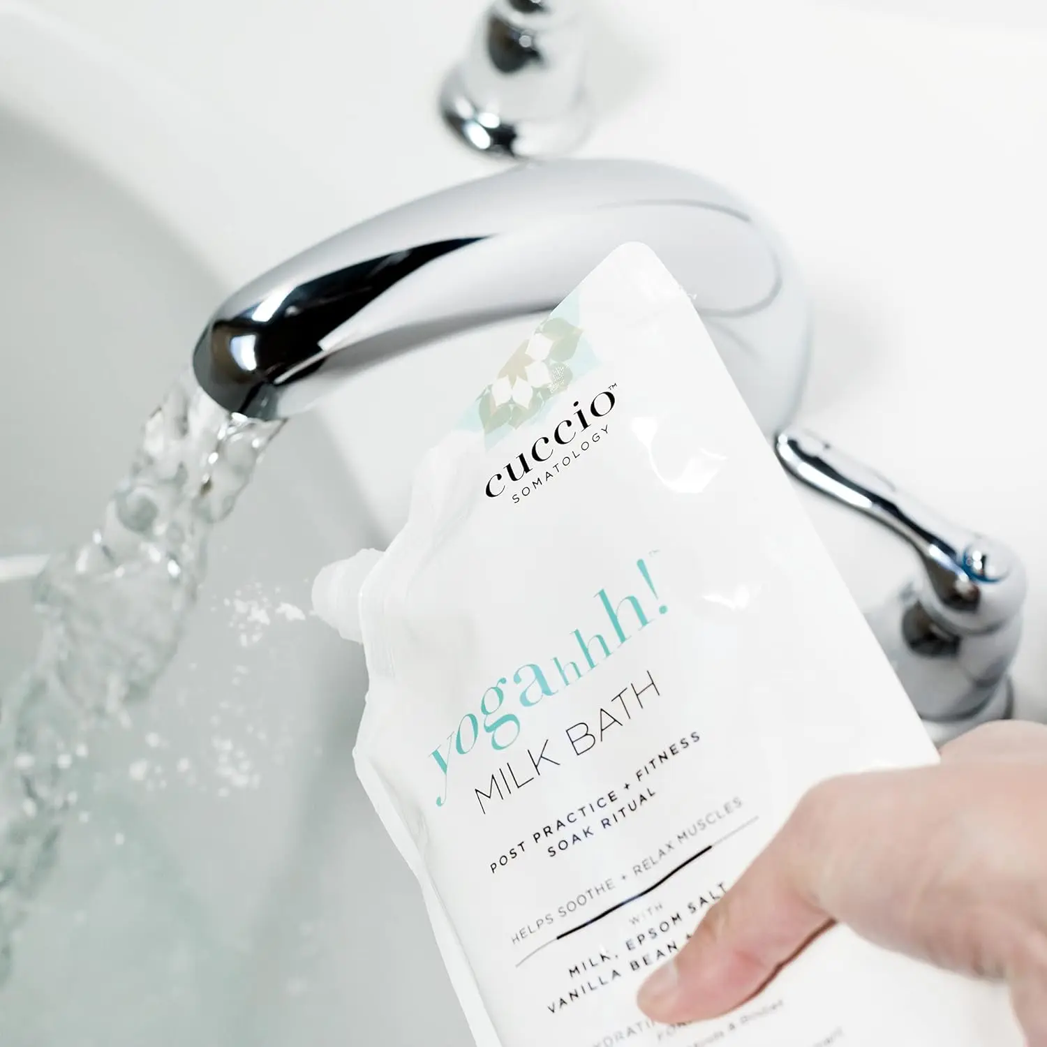 Cuccio Somatology milk bath soaking in water helps relieve sore muscles and hydrate dry skin for full body wellness and relaxation.