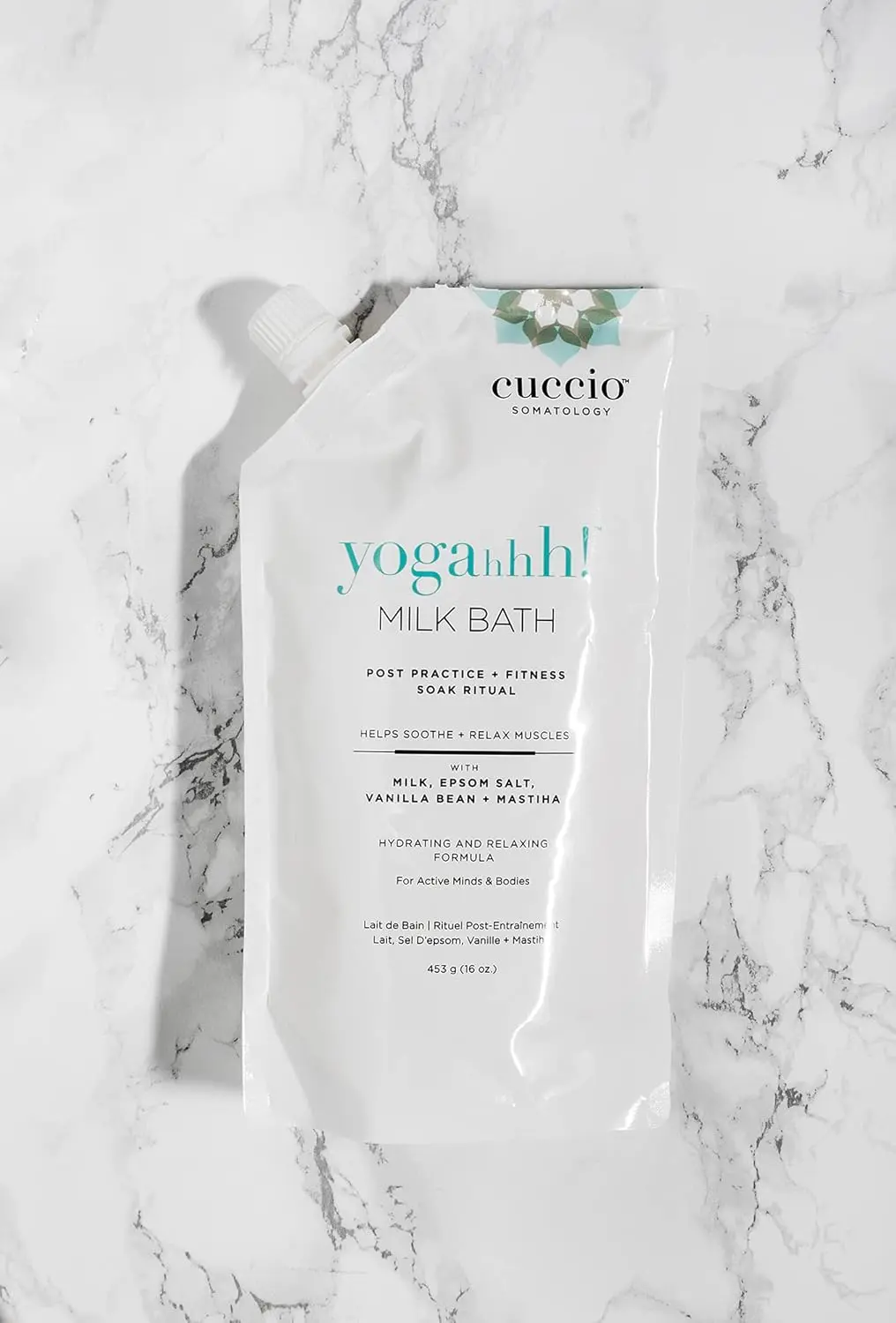 Cuccio Somatology milk bath soaking in water helps relieve sore muscles and hydrate dry skin for full body wellness and relaxation.