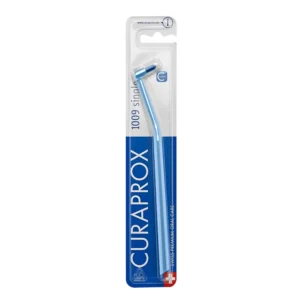 A close-up of the Curaprox single tuft toothbrush with ultra-soft CUREN bristles, designed for precise cleaning around braces, implants, and other hard-to-reach areas for healthier gums.
