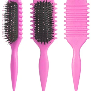 This pink curl defining brush is designed with an ergonomic handle and special bristles to easily detangle, shape, and style curly hair, restoring natural shine and reducing frizz.