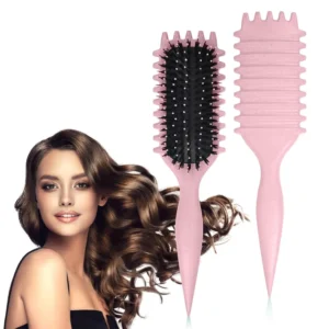 Pink curl defining brush for styling, detangling, and shaping curly hair, suitable for wet and dry use.