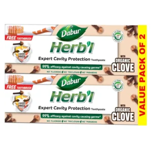 Dabur Herbal Clove toothpaste protects against cavities with natural ingredients and provides relief from toothache, shown with a bonus toothbrush.