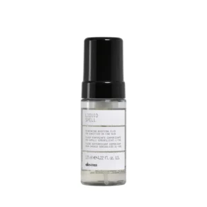 A 4.23 fl oz bottle of Davines Liquid Spell Reinforcing Bodifying Fluid, made in Italy with ingredients like soy and wheat amino acids to strengthen hair.