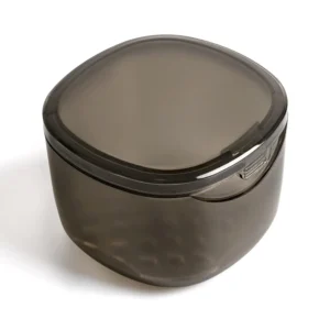 Transparent grey denture bath box with drain pan, ideal for cleaning dentures, retainers, mouth guards, and other orthodontic appliances.