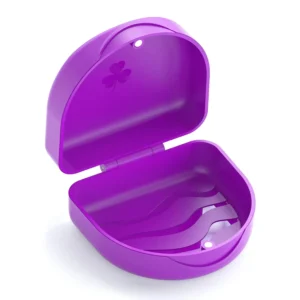 Purple denture box with secure snap closure for storing retainers, mouth guards, bite splints, and other small orthodontic appliances.