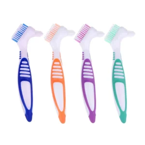 This set of four denture brushes in assorted colors is designed with moderate, multi-layer bristles and a comfort grip handle for effective and gentle cleaning of false teeth, making it ideal for travel and daily use.