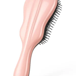 Rose gold violin shaped detangling brush for women and kids with flexible bristles for effortless knot removal on wet or dry hair.