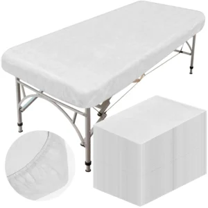 These are 50 white, disposable, oilproof, and waterproof fitted massage bed sheets with elastic bands, each measuring 39 x 87 inches, suitable for spa and salon use.
