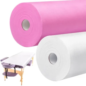 Two rolls of disposable non woven massage table sheets, one pink and one white, offering waterproof and breathable protection for spa and salon use.