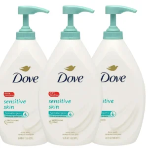 Three bottles of Dove Sensitive Skin Body Wash with pumps offer hypoallergenic and moisturizing cleansing for soft, healthy-looking skin.