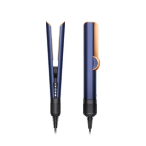 The Dyson Airstrait in Prussian blue dries and straightens hair simultaneously, creating a natural, shiny, and voluminous straight style whether used on wet or dry hair with its unique boost mode.