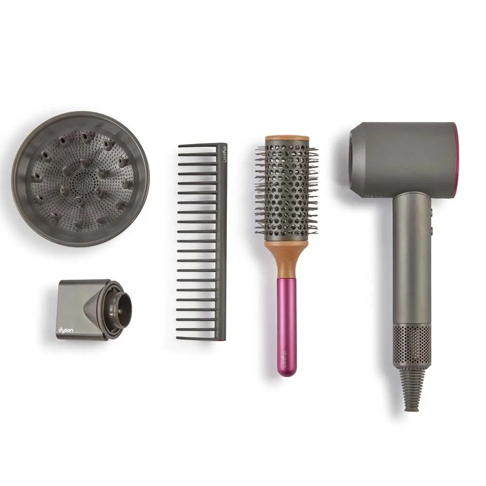 This Dyson Supersonic hair dryer styling set includes a concentrator, diffuser, brush, and detangling comb for creating a variety of hairstyles.