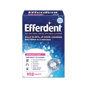 Efferdent Complete Clean antibacterial tablets are shown, designed for daily cleaning of retainers, dentures, aligners, and other dental appliances, effectively removing stains and fighting odor-causing bacteria.