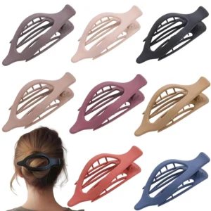 A set of large, flat hair clips in various neutral colors, designed for women with thick or thin hair, providing a strong, no-slip grip and a comfortable, lay-flat design.