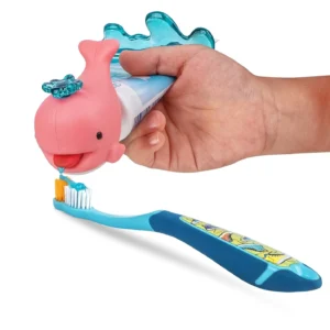Pink Flipper Whale toothpaste squirter designed for kids, dispensing a controlled amount to prevent waste and promote healthy dental habits.
