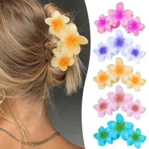 These cute flower claw clips feature a plumeria design and provide a strong, nonslip hold for various updo hairstyles, making them perfect beach hair accessories for women and girls.