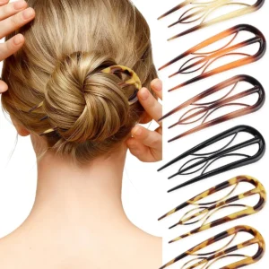 A woman secures a stylish updo with AWAYTR French hair pins, showcasing effortless elegance for all hair types.