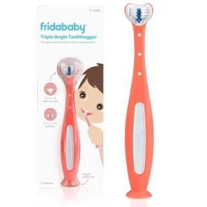 A pink Frida Baby Toothhugger toothbrush with a triple-angle brush head designed to clean all sides of toddler's teeth at once.
