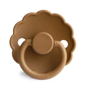A cappuccino-colored FRIGG Daisy silicone pacifier designed for babies 6-18 months, featuring a cherry nipple and a soft, scalloped shield with air holes to promote healthy airflow.
