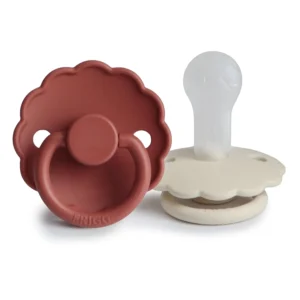 Two-pack of FRIGG Daisy pacifiers in baked clay and cream colors, size 2, designed for babies 6-18 months and made with SilkySoft medical grade silicone.