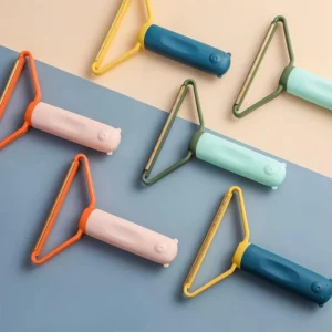 A green manual fuzz shaver is shown removing lint and pet hair from a couch, effectively cleaning furniture.