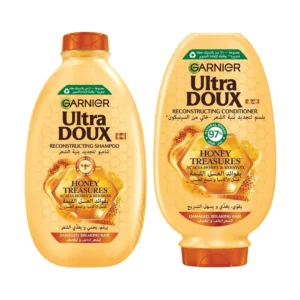 Garnier Ultra Doux Honey Treasures shampoo and conditioner set repairs fragile, damaged hair with royal jelly, propolis, and honey for stronger, shinier results.