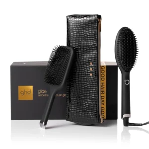 The ghd Glide smoothing hot brush gift set includes a hot brush, paddle brush, and heat protection case for creating smooth, frizz-free styles on dry hair.