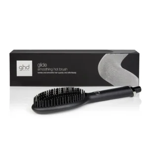 The ghd Glide hot brush in black quickly smooths and tames dry, frizzy hair with ceramic and ionic technology for healthy second-day styling.