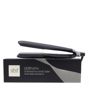 The GHD Platinum+ hair straightener in black, designed with predictive technology for optimal heat and visibly healthier hair with less breakage and preserved color.