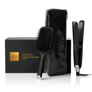 The ghd Platinum+ black straightener gift set includes a professional advanced styler for colored and sensitive hair, a ghd brush, and a heat-resistant case, offering gentle styling and enhanced shine with its unique ultra-zone technology.
