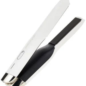 White GHD Unplugged cordless hair styler, the only on-the-go straightener with guaranteed performance, showcasing its portable design and USB-C charging port.