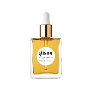 This is a bottle of Gisou Honey Infused Hair Oil, a repairing treatment designed to rebuild dry, damaged hair and add shine, suitable for all hair types and textures.