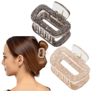This set of two small, rectangular glitter hair claw clips in silver adds a touch of sparkle and provides a secure hold for all-day comfort.