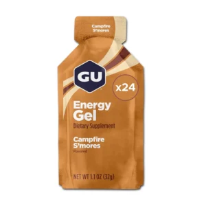A 24-pack of GU Energy Original Sports Nutrition Energy Gel in Campfire S'mores flavor, a caffeine-free, vegan, and gluten-free option containing electrolytes and branched-chain amino acids for lasting energy during training or racing.
